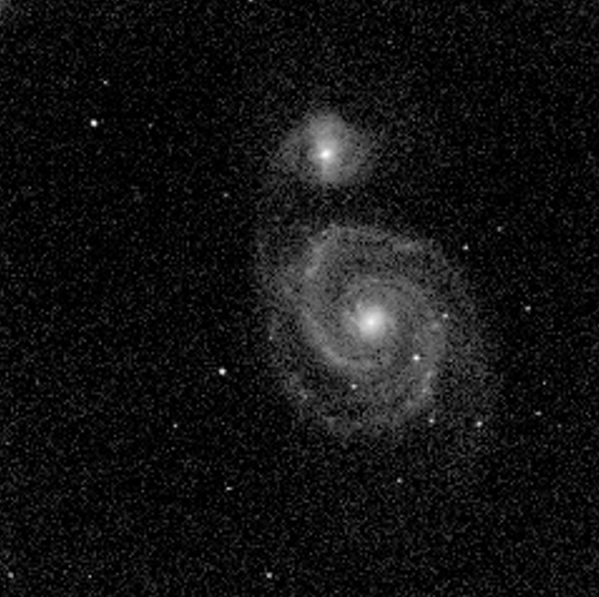 Processed telescope image of interacting galaxies from the Messier observing project.
